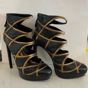 Alexander McQueen black and metallic gold cut out ankle boots